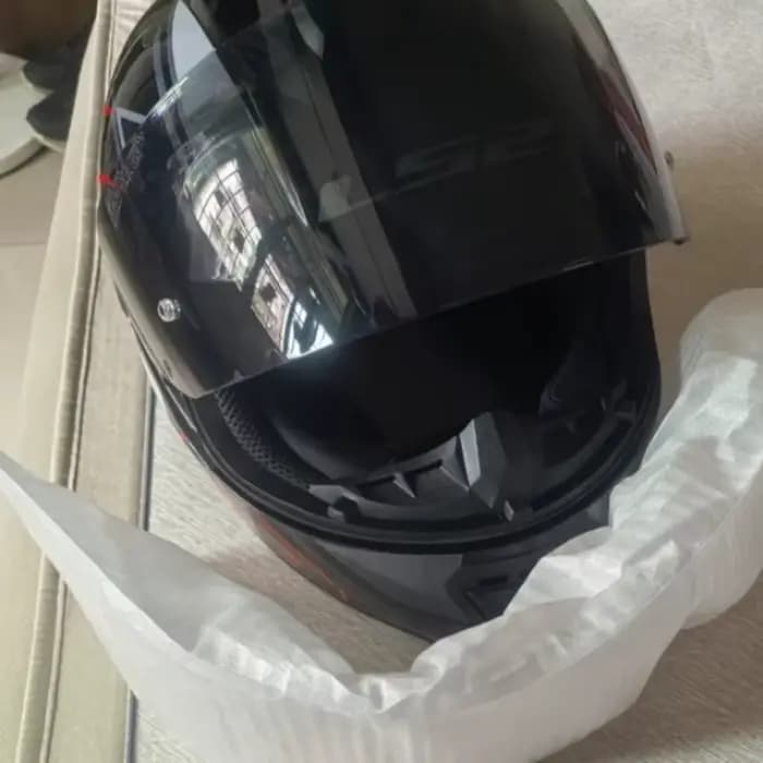 Déflecteur de vent universel pour casque de moto